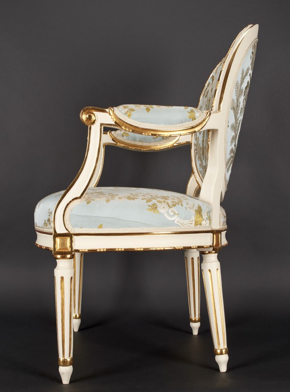 Armchair with medallion-shaped armrests