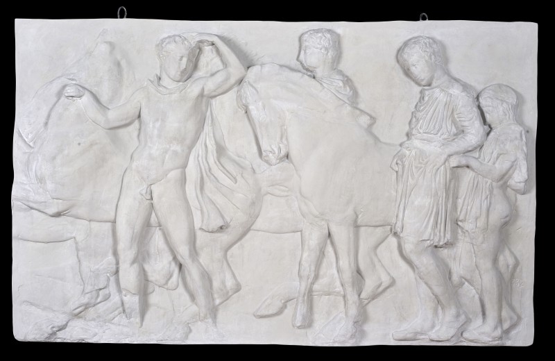 Scene of preparation for the cavalcade in Panathenaic procession (the commemoration of the birthday of the goddess Athena). Fragment of a relief from North frieze of Parthenon.
