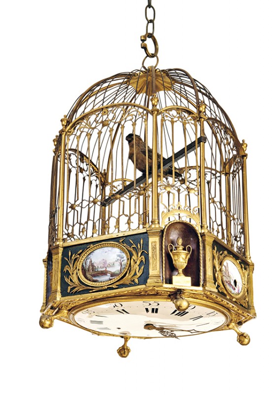 Musical clock in the form of a cage with bird