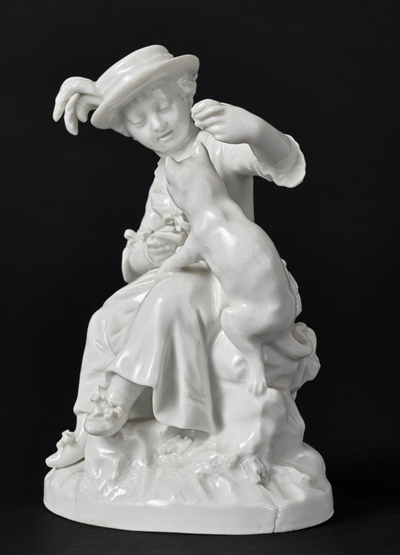 Figurine of a girl with cat