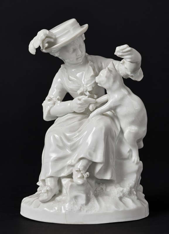 Figurine of a girl with cat